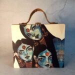 Trio of Temptation Suitcase Clutch