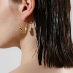 echo hoops earrings wear by an woman