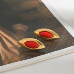 2 pairs of earrings placed on a table