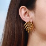 leaf shape earrings wear by an woman