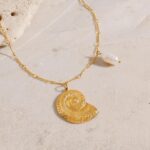 snail golden pendant close view